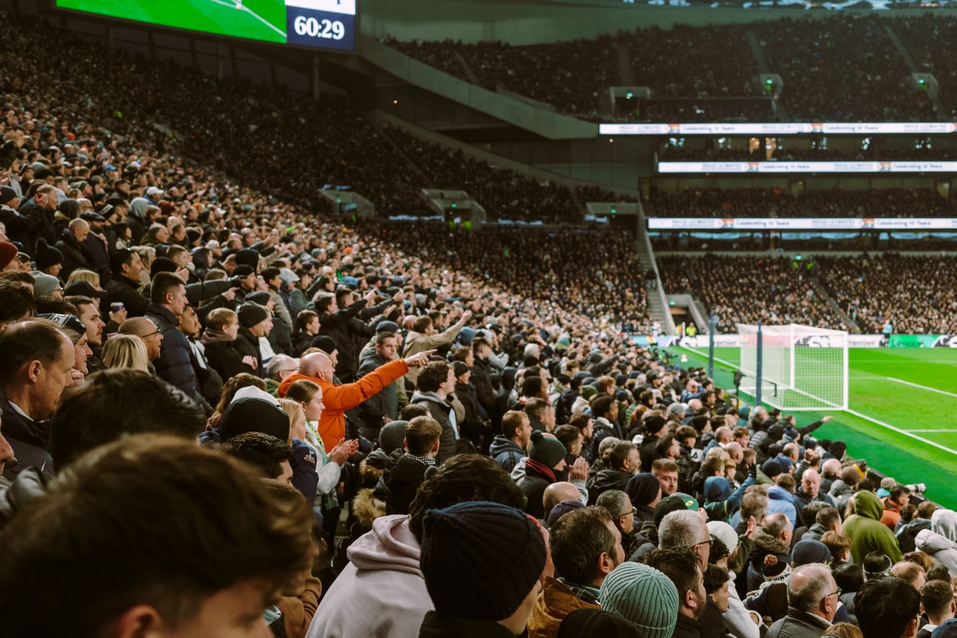 Tottenham fans in the stands cheering